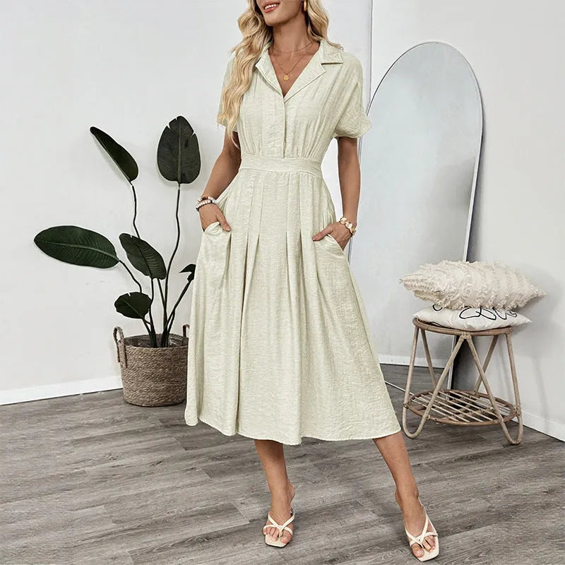 Light green women's shirt dress with lapel collar, waist tie, and side pockets on a model.