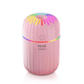 Mini USB-powered humidifier with animal design in green colour, showing compact size and data cable connection