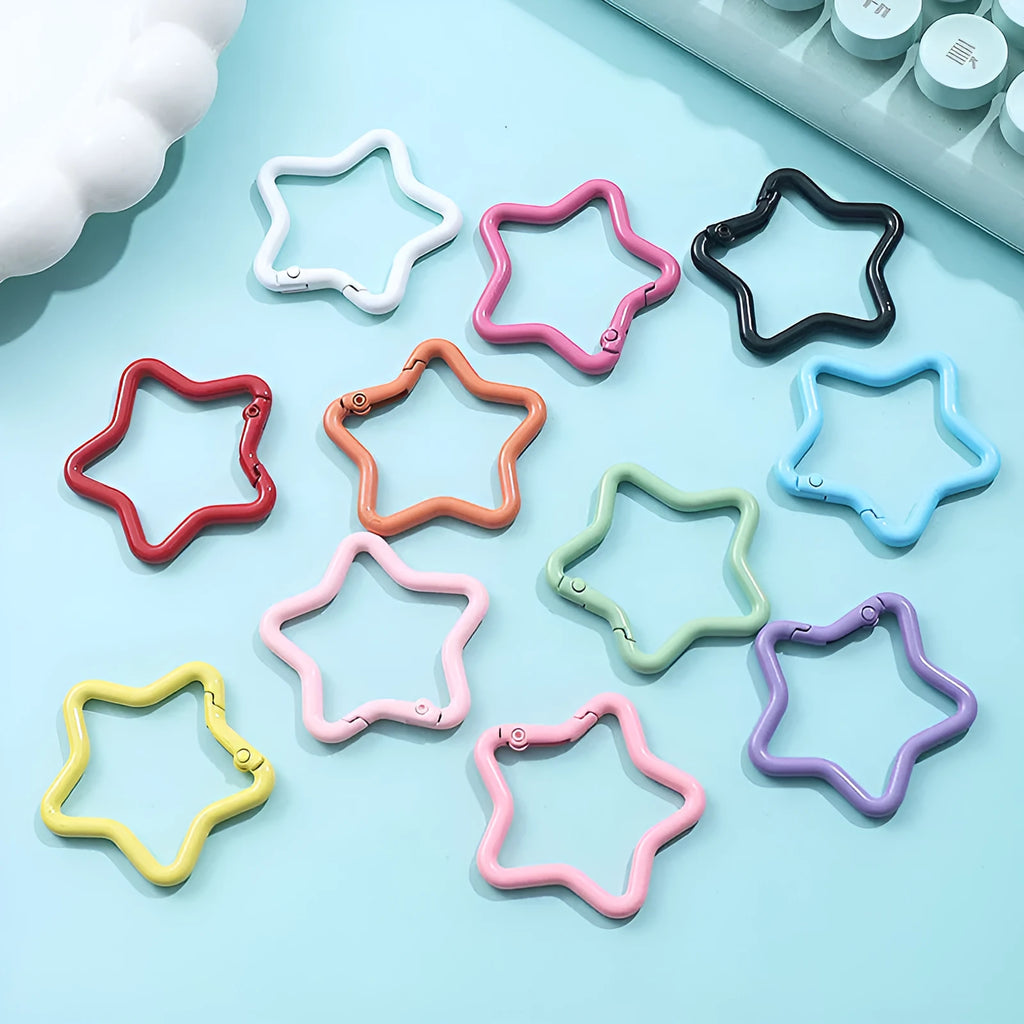 Zinc alloy five-pointed star keychain in light pink, one of ten available macaron colours.