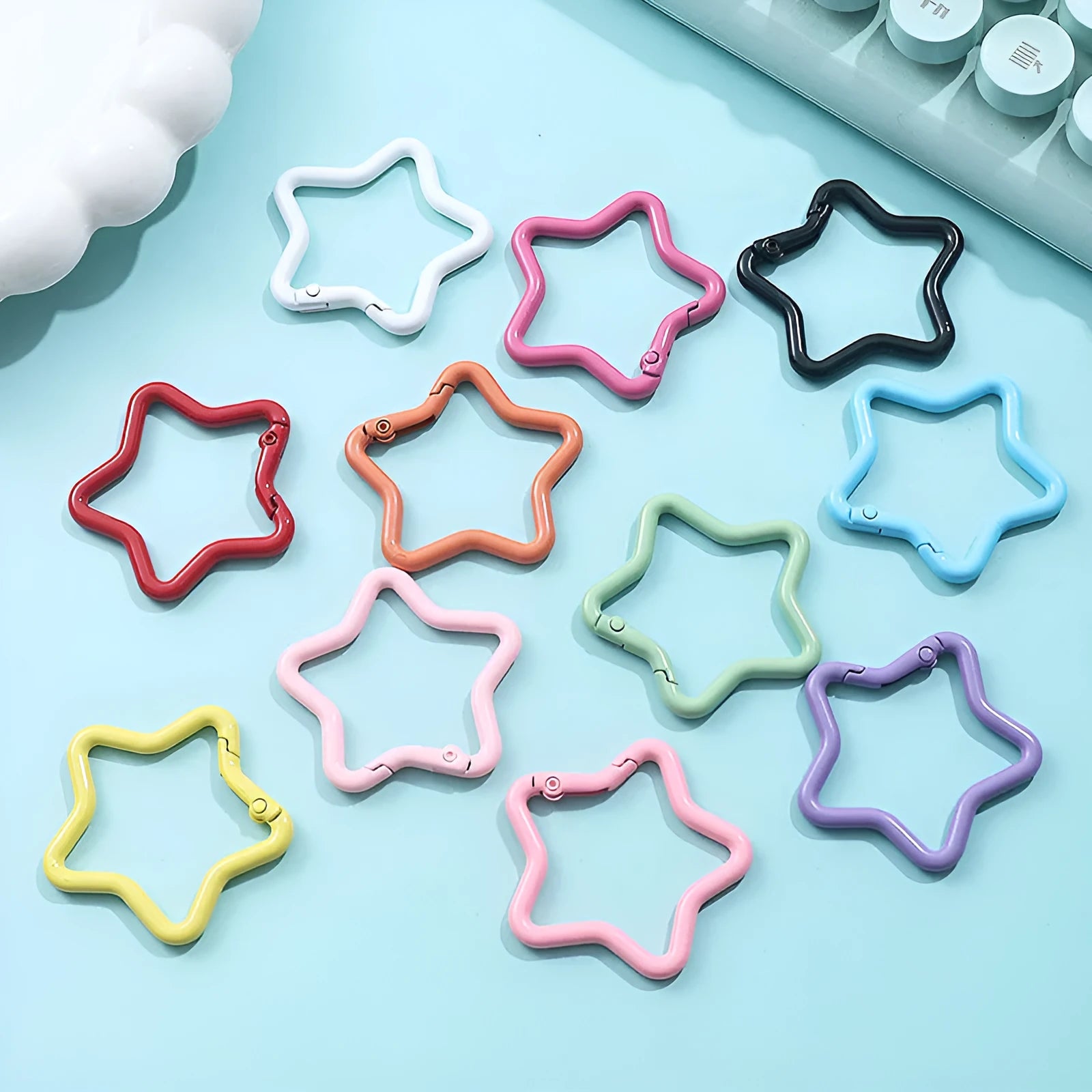 Zinc alloy five-pointed star keychain in light pink, one of ten available macaron colours.