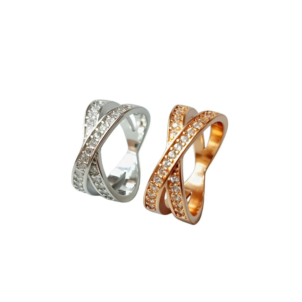 Silver or rose gold couple ring with micro-inlaid cross and geometric design on a copper band.