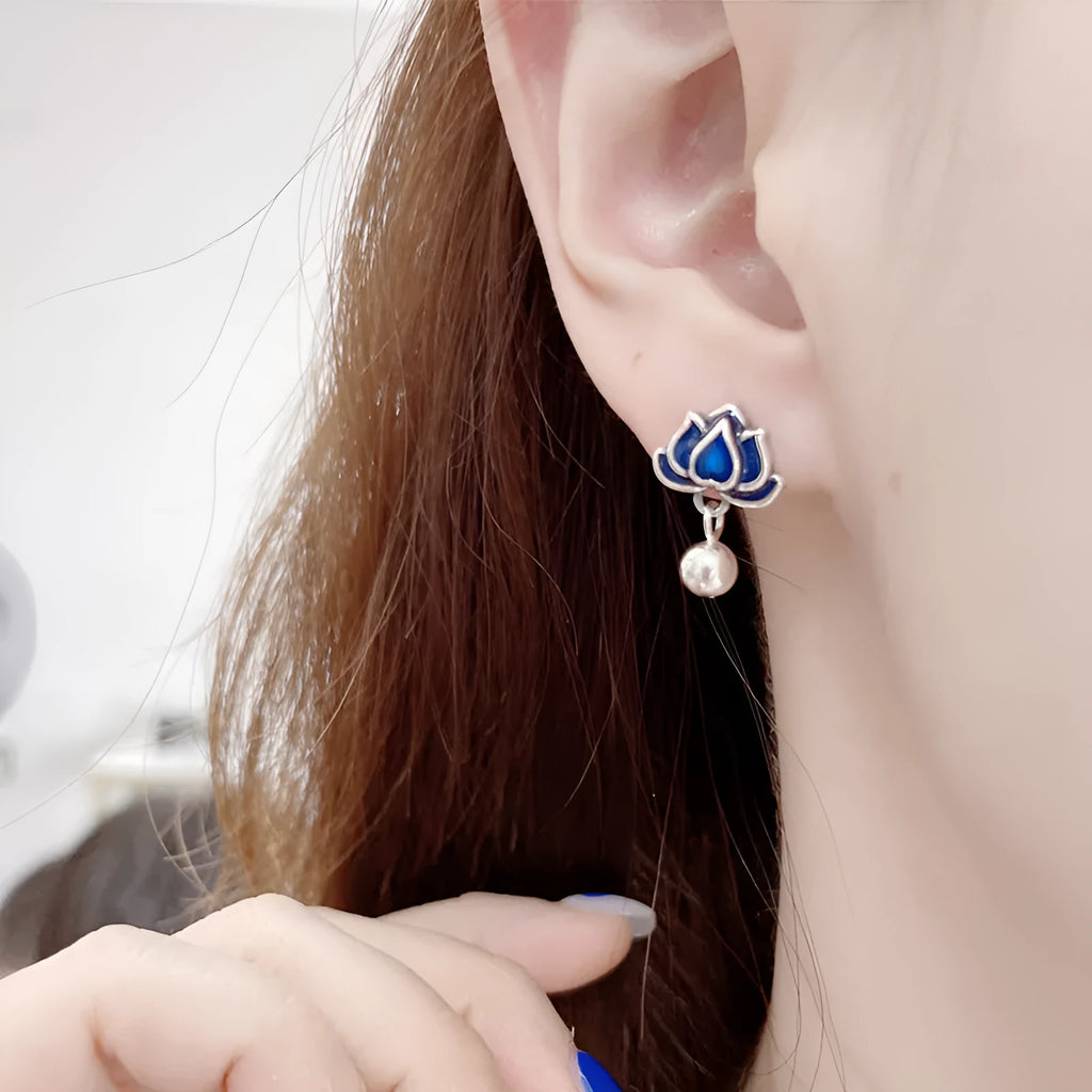 Blue lotus seedpod earrings with artistic tassel detailing on flower-shaped 1.2cm studs