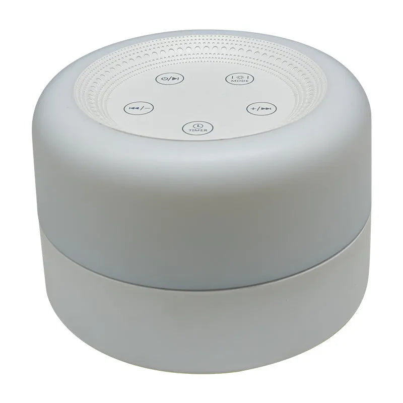 White rechargeable white noise sleeping aid table lamp with colourful lights on bedside table