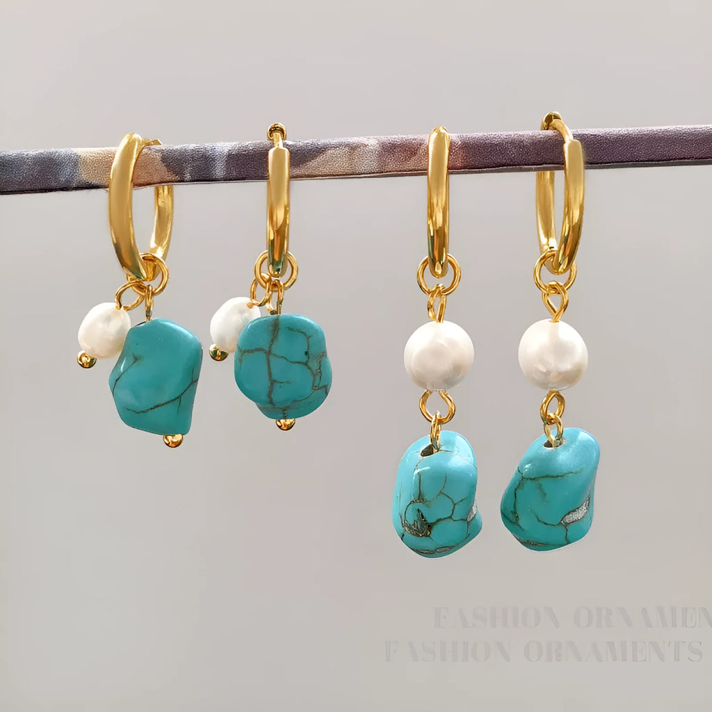 A pair of geometric turquoise and cultured pearl clip-on earrings on a copper setting.