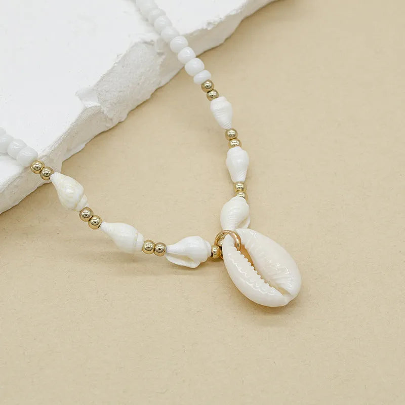 Cold Wind white conch shell necklace with mother-of-pearl pendant on regular chain