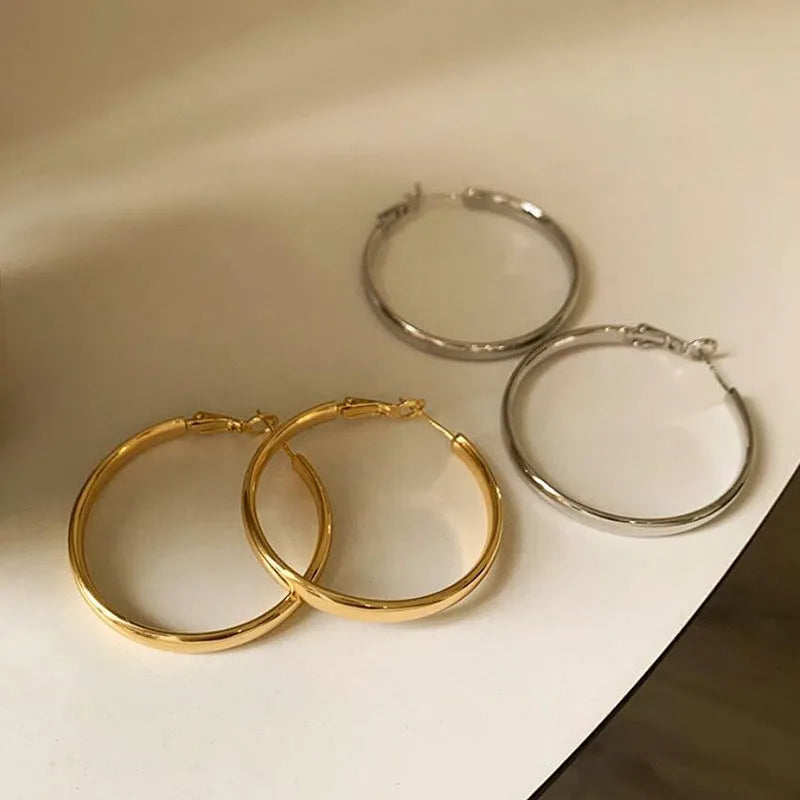 Large 40mm circular metal hoop earrings in gold or silver electroplated finish