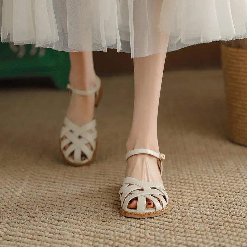 Women's flat closed toe sandals with word strap and buckle in beige colour