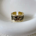 Adjustable copper ring with distressed finish and geometric drop oil design
