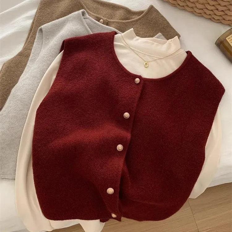 Women's thin polyester pullover vest with half sleeves in a choice of six colours on a hanger.