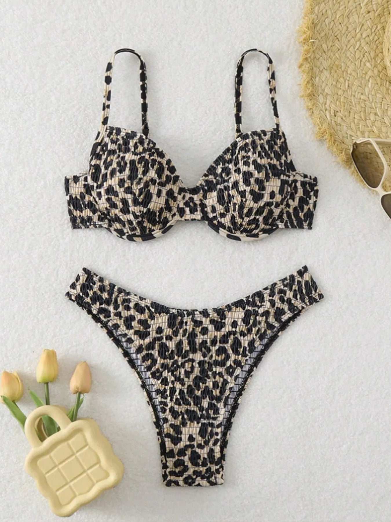 Women's leopard print bikini set with backless top and briefs bottom in brown and red colour options.