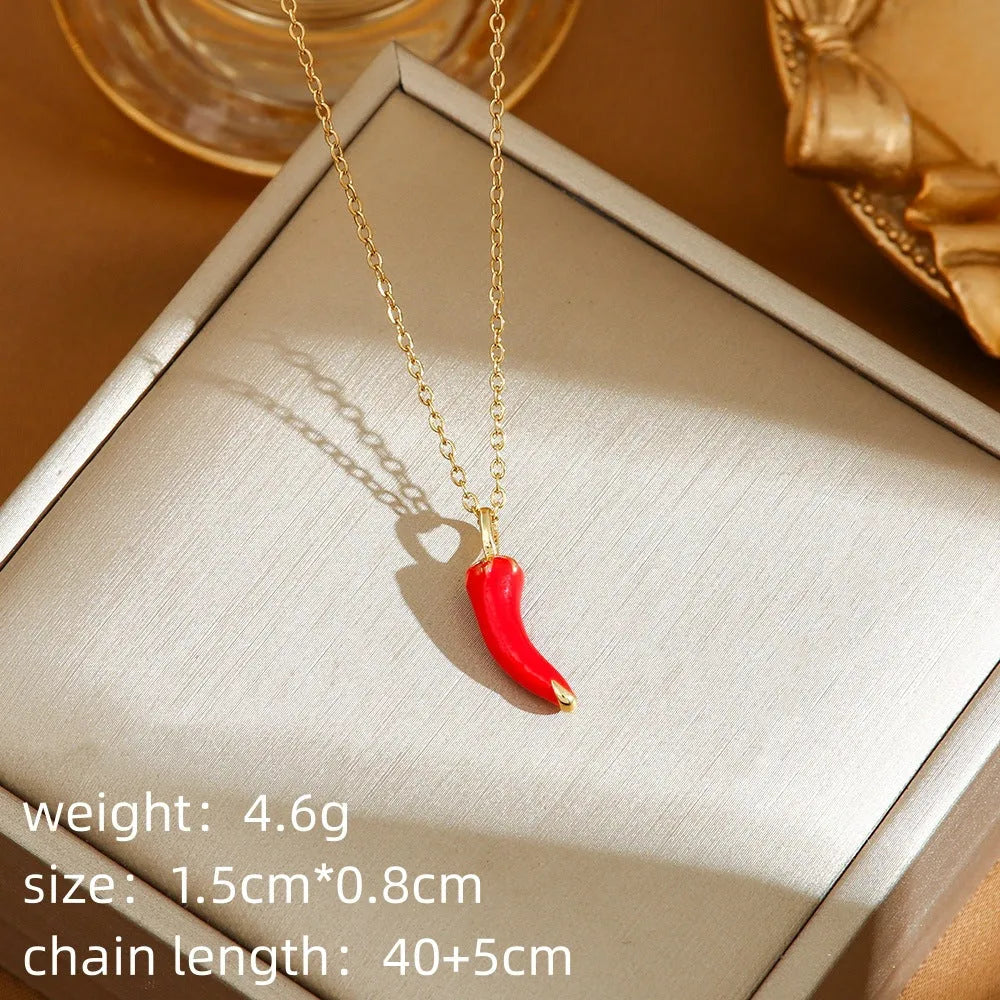 Titanium steel necklace with delicate fruit pendant on O-ring chain, available in golden and steel zircon finishes.