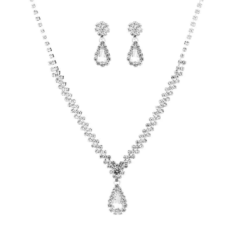 Claw chain necklace and matching drop earrings set with rhinestones in multiple colours.