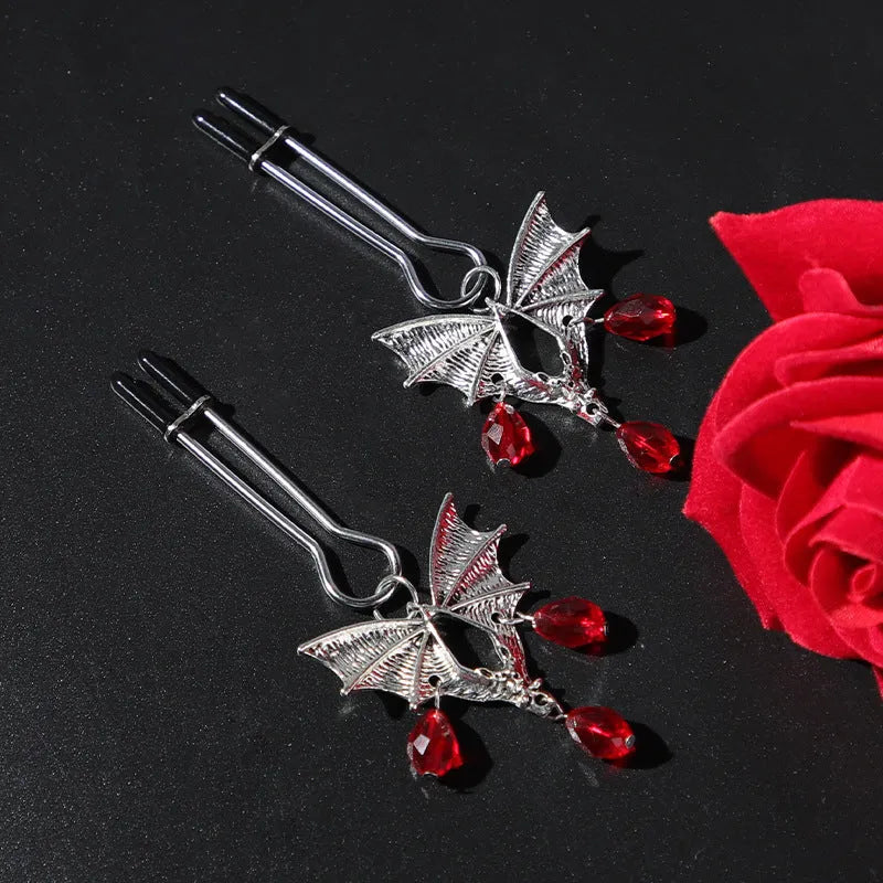 Silver diamond bat nipple clamp adjustable clitoral clip jewellery on black background