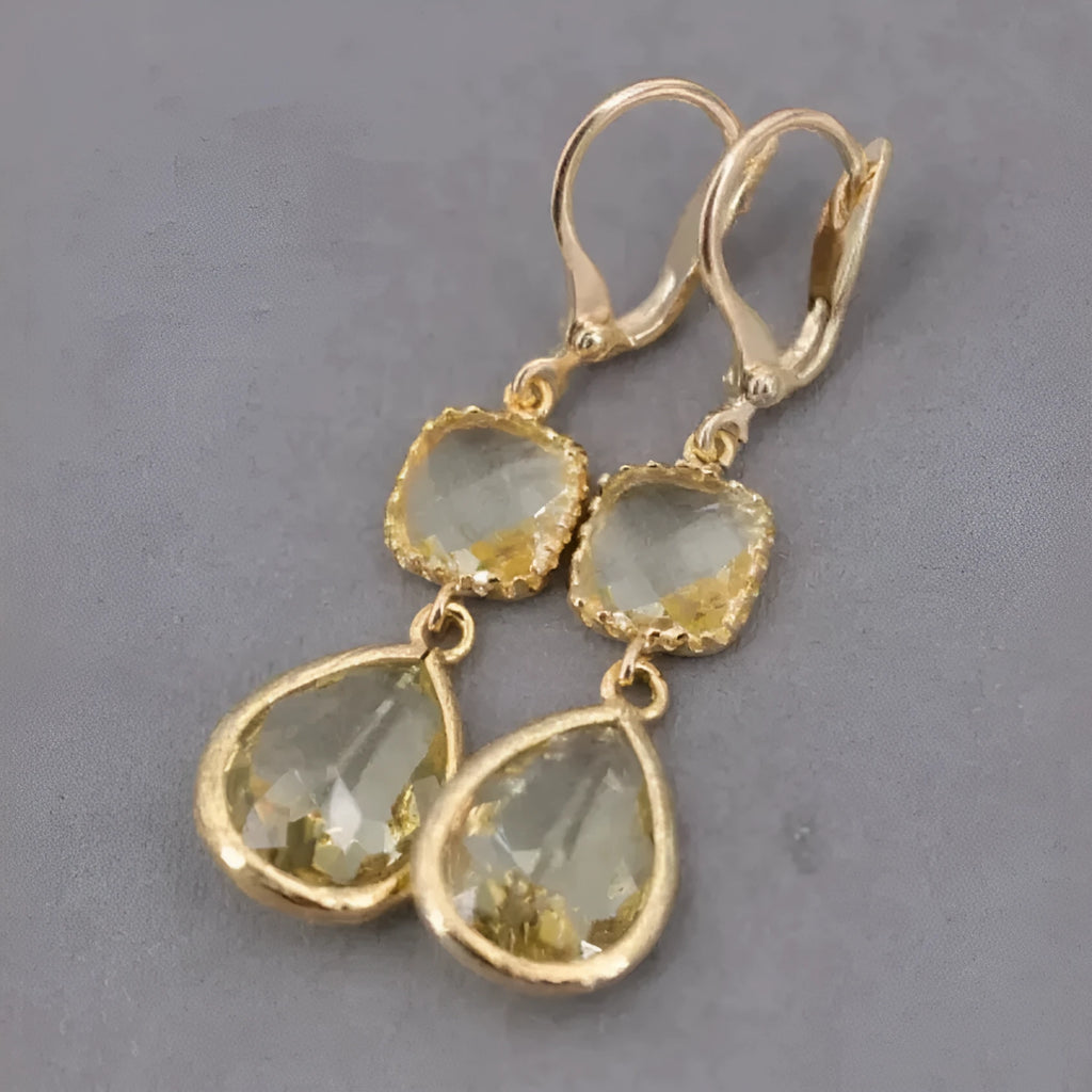 Gold geometric long fringe drop earrings with water droplet crystal decorations on copper material
