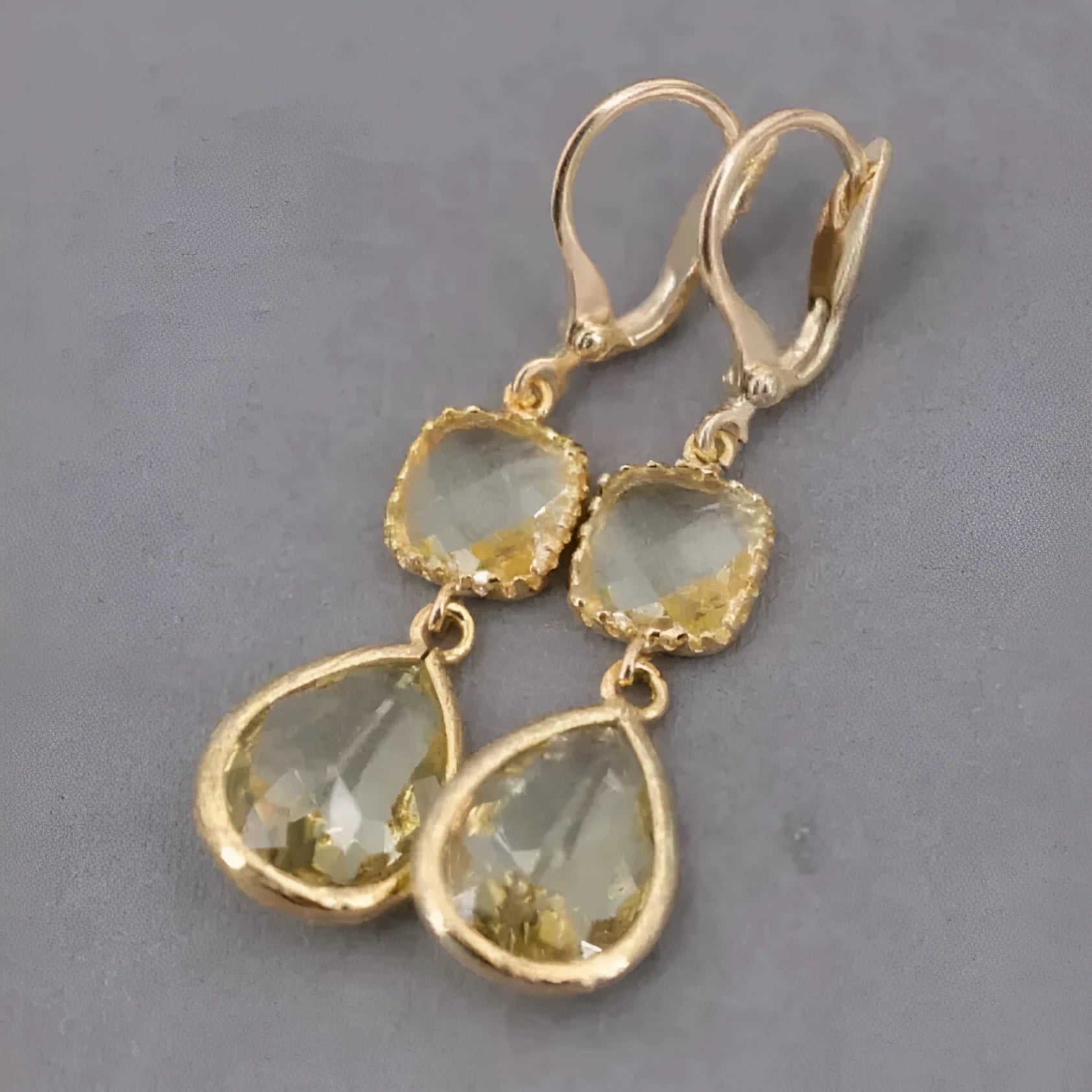 Gold geometric long fringe drop earrings with water droplet crystal decorations on copper material