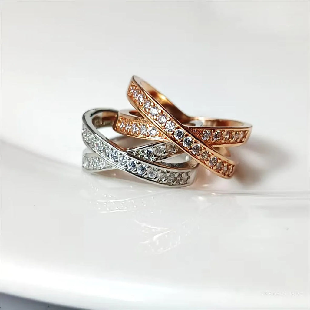 Silver or rose gold couple ring with micro-inlaid cross and geometric design on a copper band.