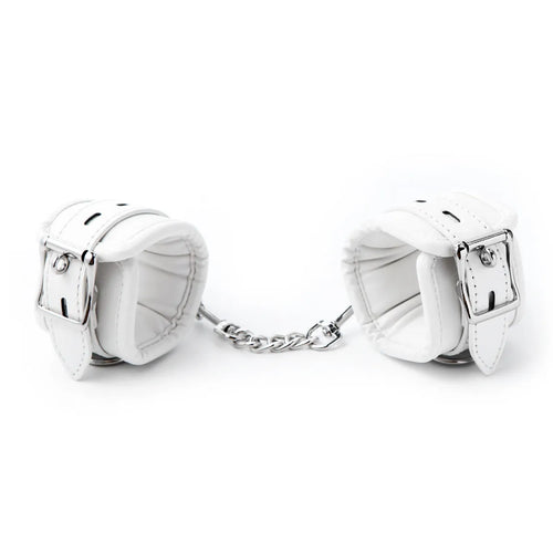 White PU sponge bondage restraint set showing handcuffs, footcuffs, and a neck collar.