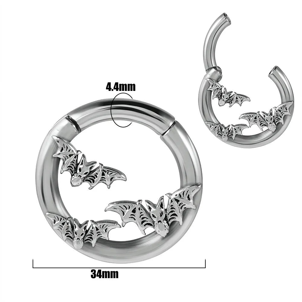 A pair of stainless steel fashion earrings featuring a geometric totem pattern with an electroplated coloured finish.