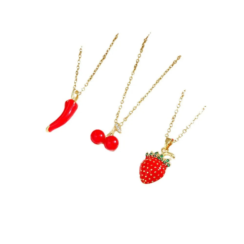 Titanium steel necklace with delicate fruit pendant on O-ring chain, available in golden and steel zircon finishes.