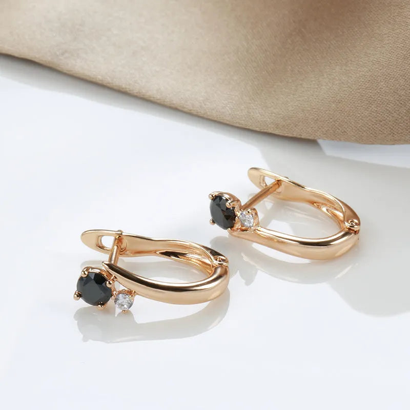 Gold geometric drop earrings with black agate inlay on copper