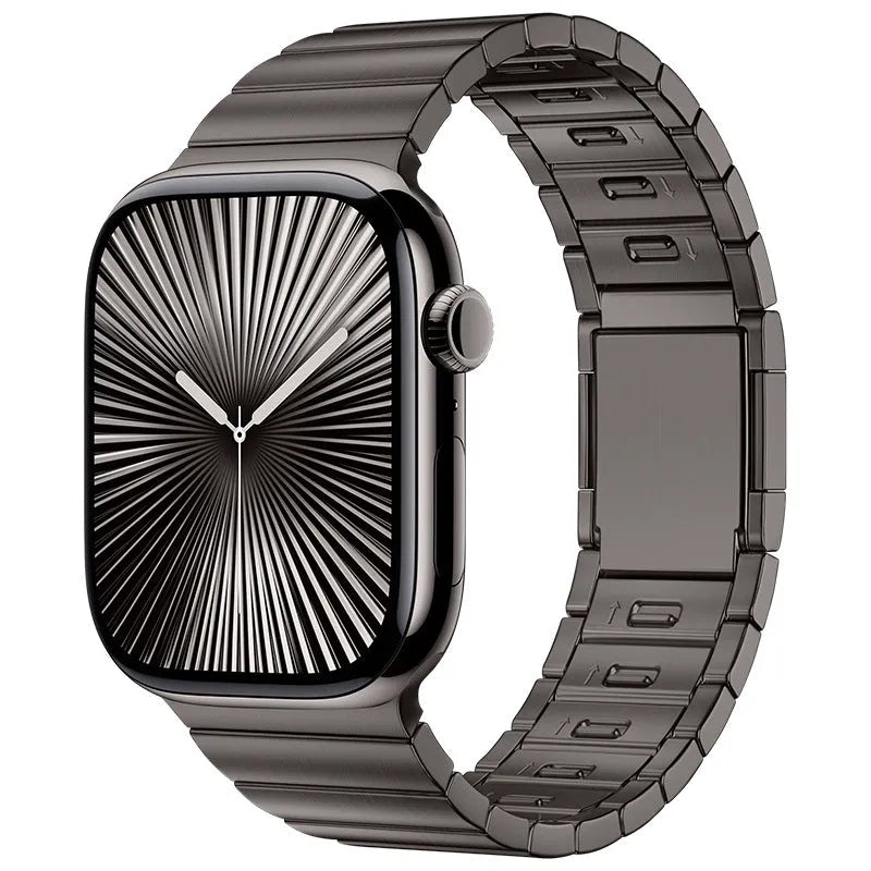 Silver stainless steel Apple Watch strap with magnetic buckle on a wrist, showing business style design.