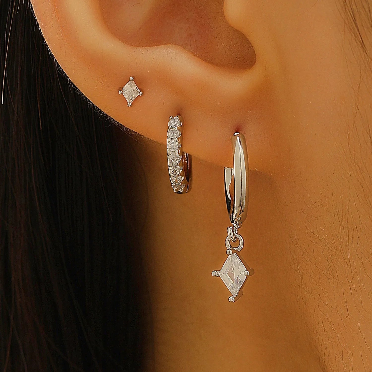 Geometric pattern copper earring set with zircon stones in clip, stud, and dangle styles