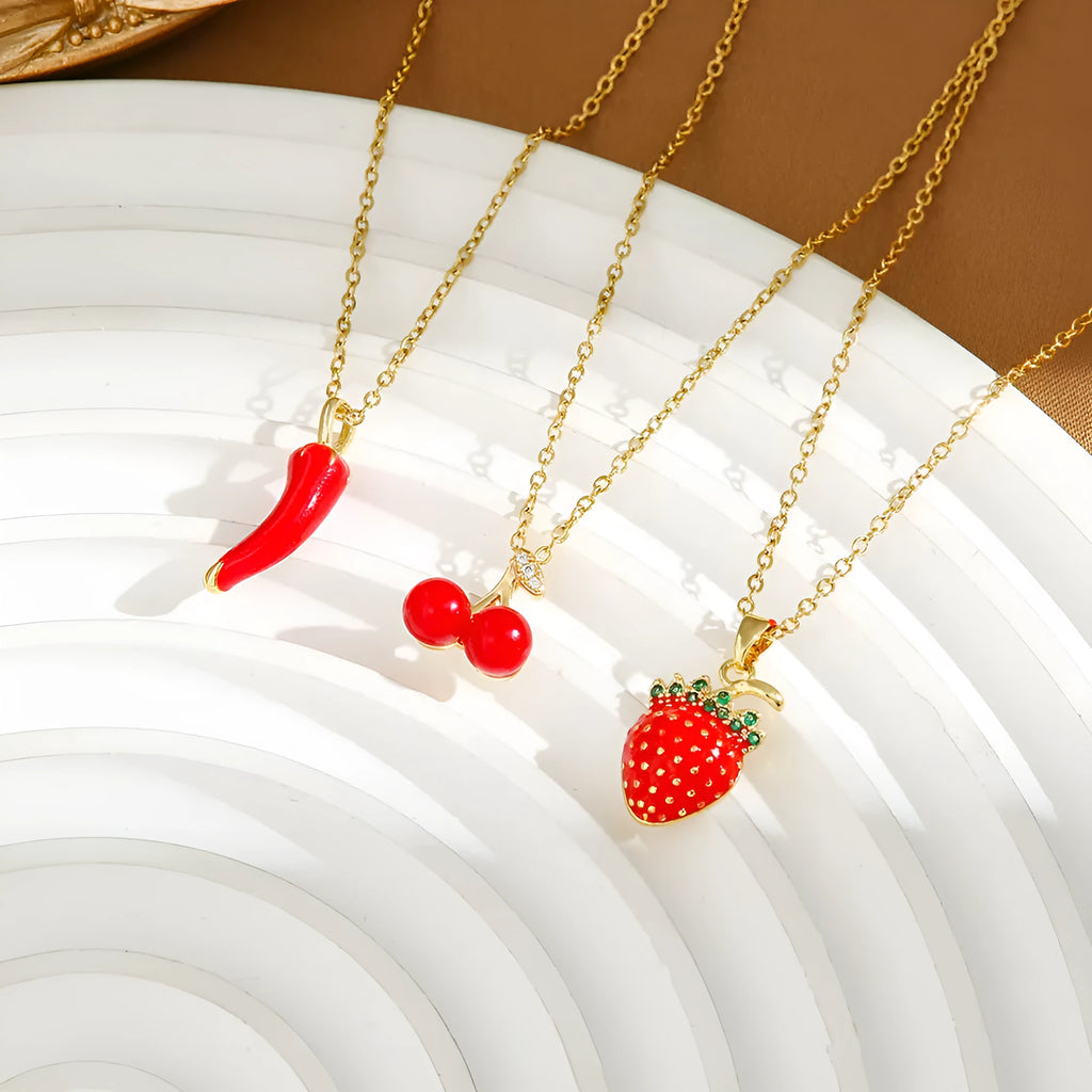 Titanium steel necklace with delicate fruit pendant on O-ring chain, available in golden and steel zircon finishes.
