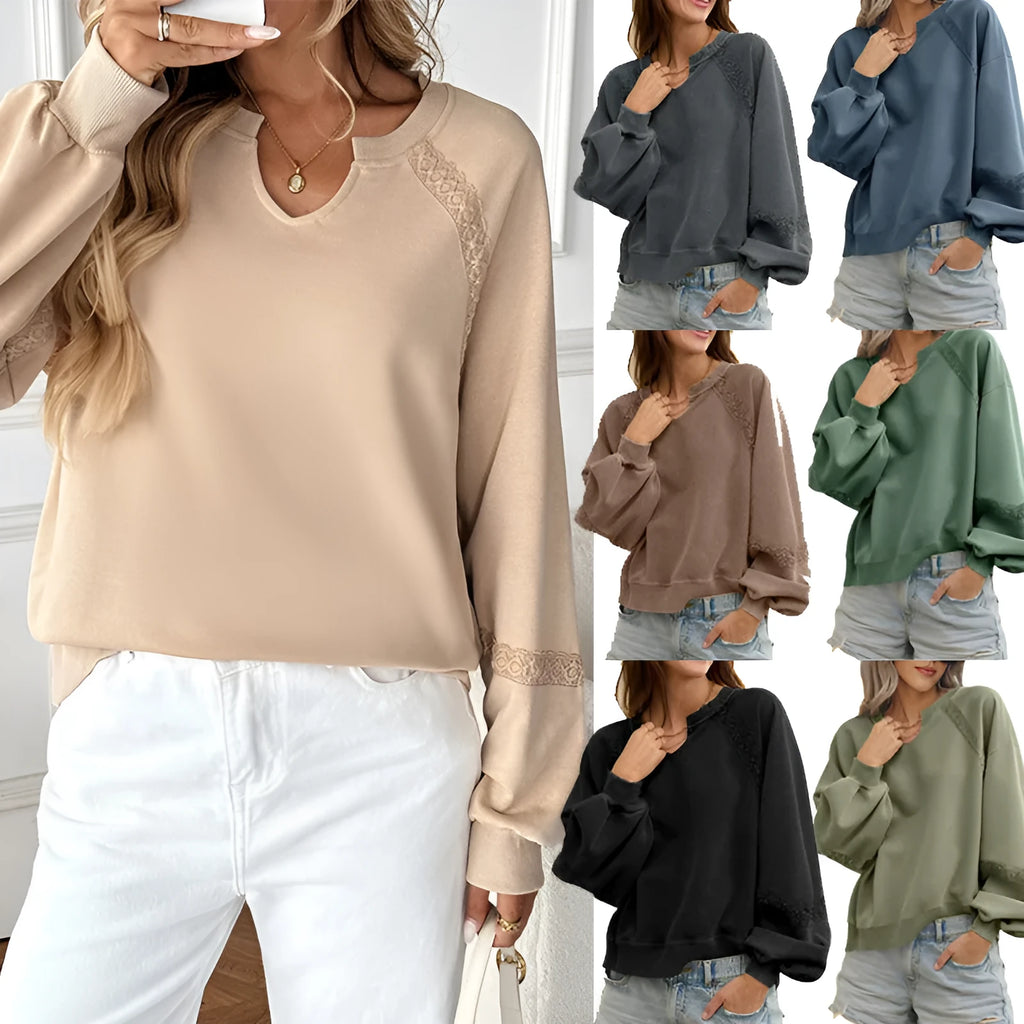 Women's loose-fit sweater in apricot with a half-open collar, lace stitching detail, and long sleeves.