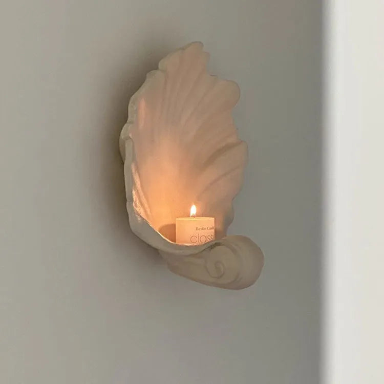 White resin shell-shaped ornament for fruit plate decoration on a table