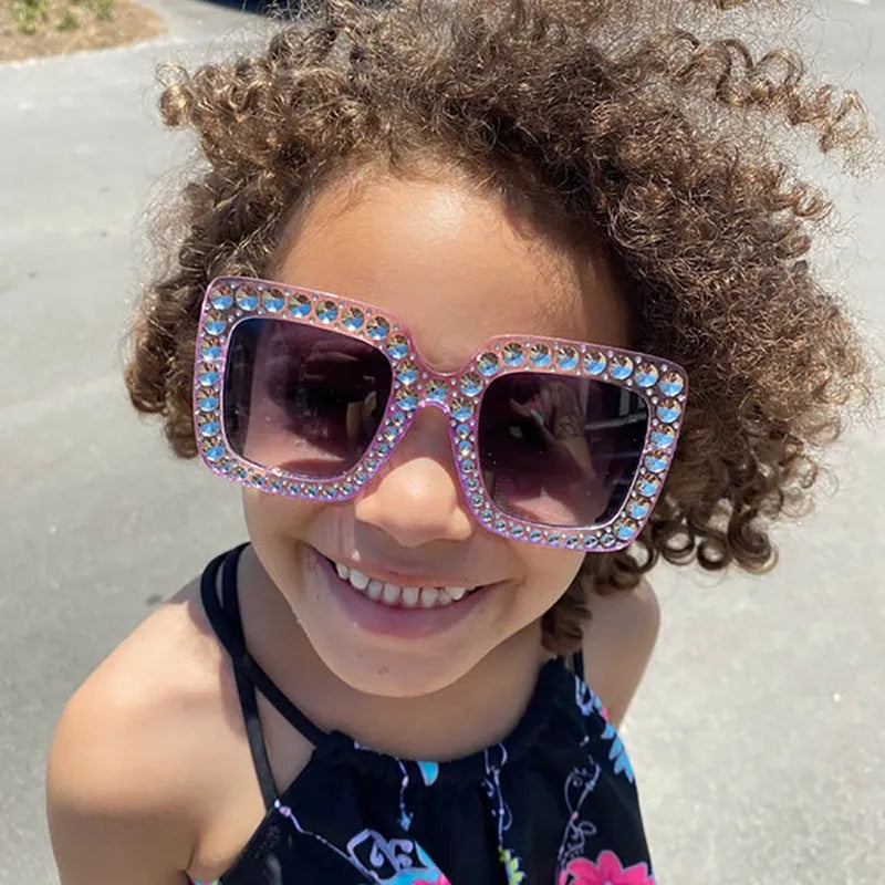 Plastic fashion sunglasses in multiple colour options including black, pink, and transparent frames