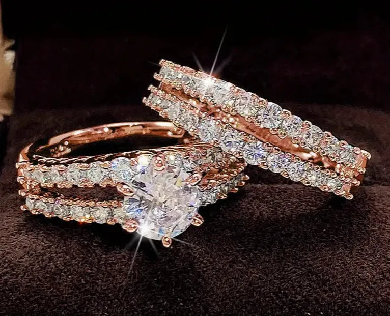 A 2 in 1 set of fully-jewelled geometric rings for women, shown in rose gold, silver, and gold colour options.