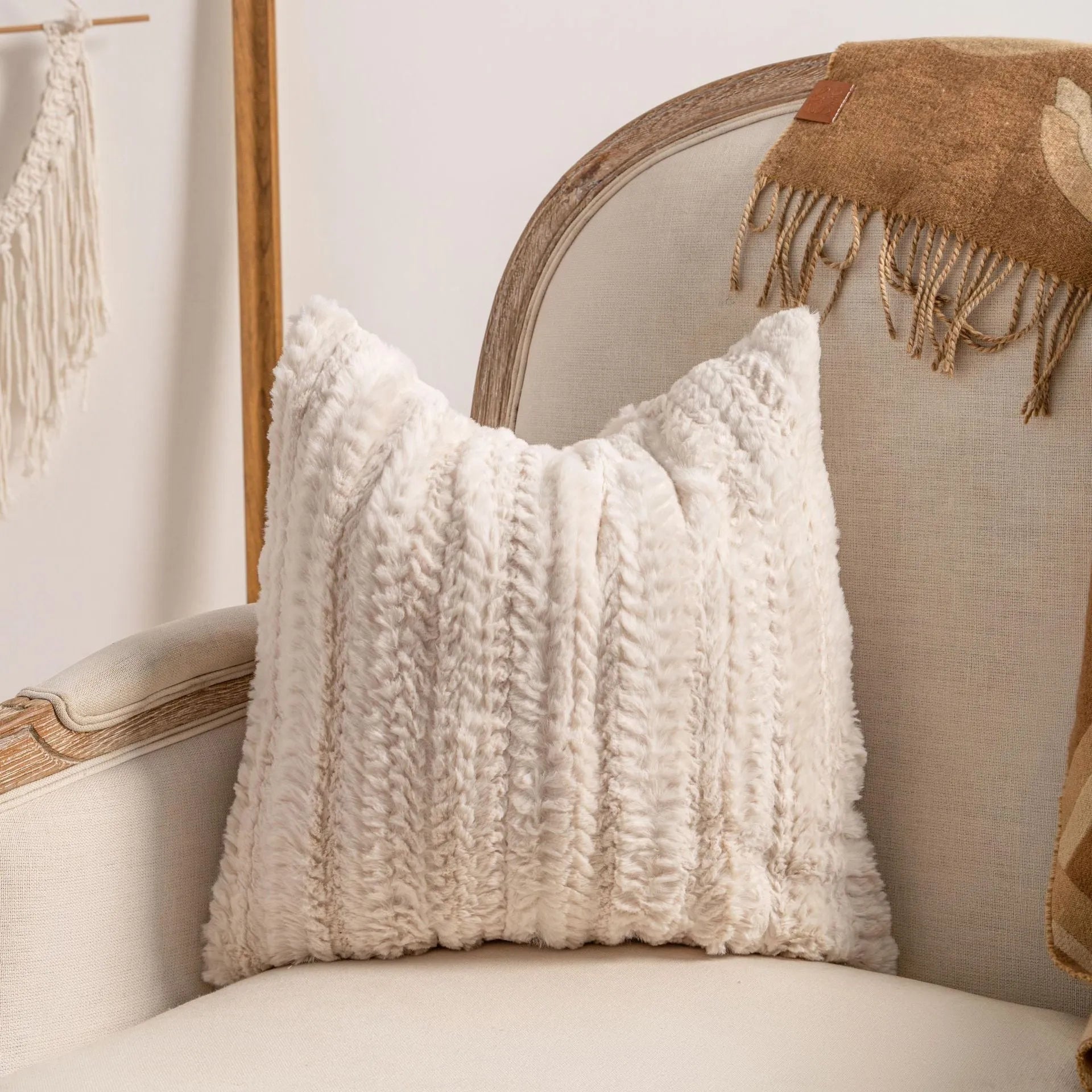 Knitted cushion cover with tassel trim in a printed spiral dots pattern, shown in 45x45cm size.