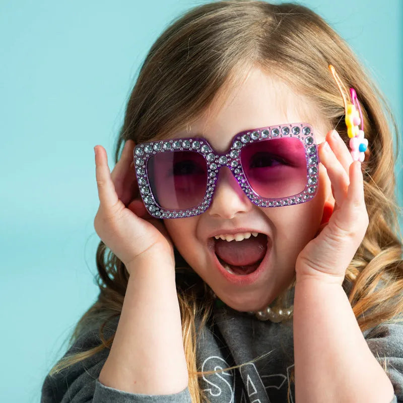 Plastic fashion sunglasses in multiple colour options including black, pink, and transparent frames