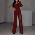 Black women's jumpsuit with an oblique shoulder design and a high slit on the leg.