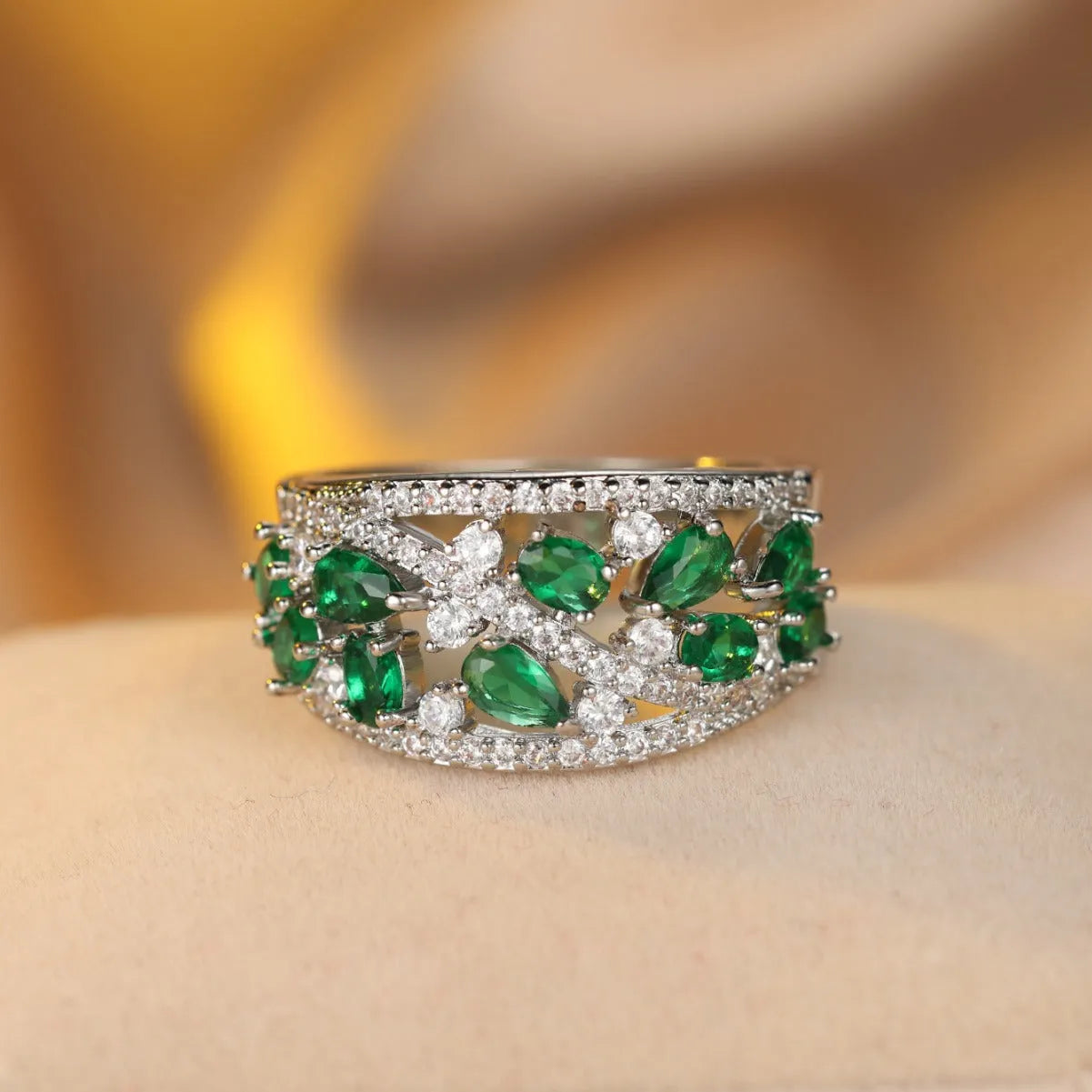 Women's round hollow copper ring with gemstone accents in gold or platinum plating with white or blue stones