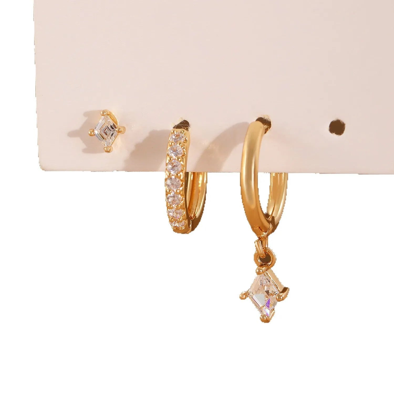 Geometric pattern copper earring set with zircon stones in clip, stud, and dangle styles