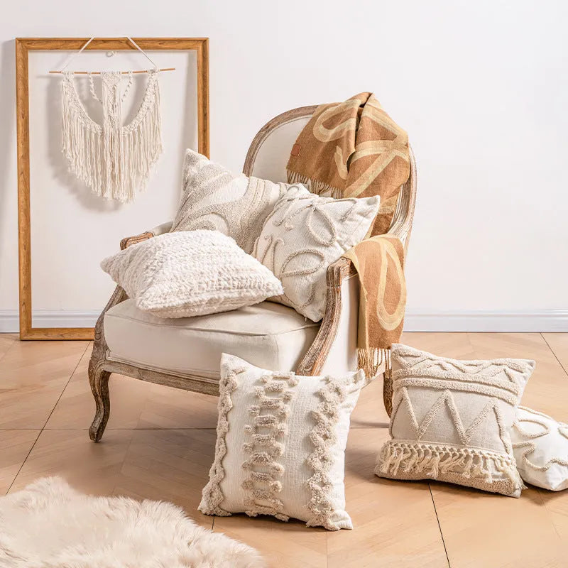 Knitted cushion cover with tassel trim in a printed spiral dots pattern, shown in 45x45cm size.