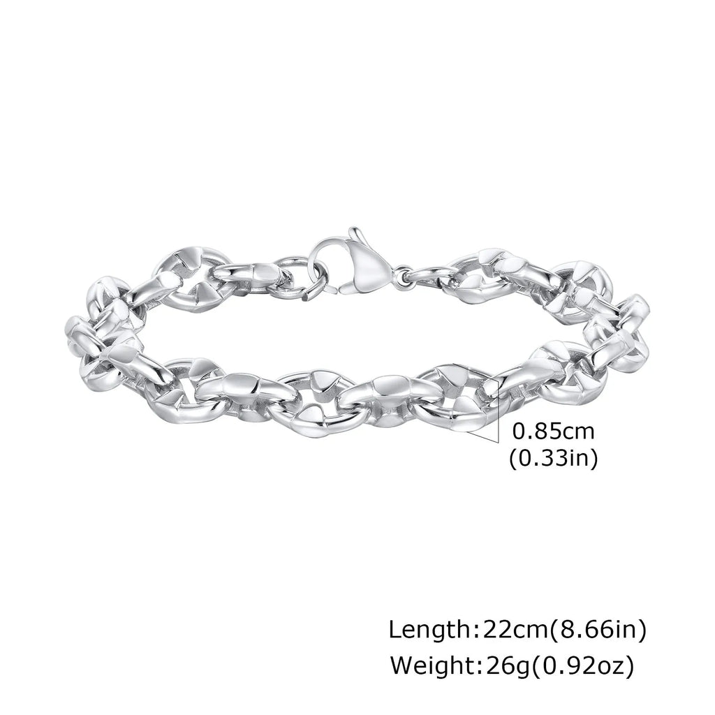 A thick geometric chain bracelet made from stainless steel in a steel colour, shown on a wrist.