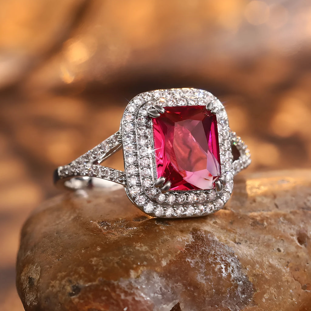 Women's geometric square copper ring with crystal rhinestones in red, showing princess design