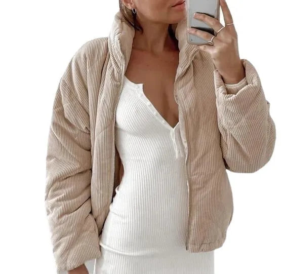 Women's apricot-coloured corduroy jacket with a stand collar and front zipper, laid flat.