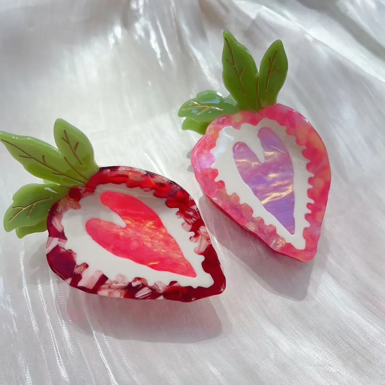 Handmade strawberry design hairpin for girls, shown in red and pink colour options.