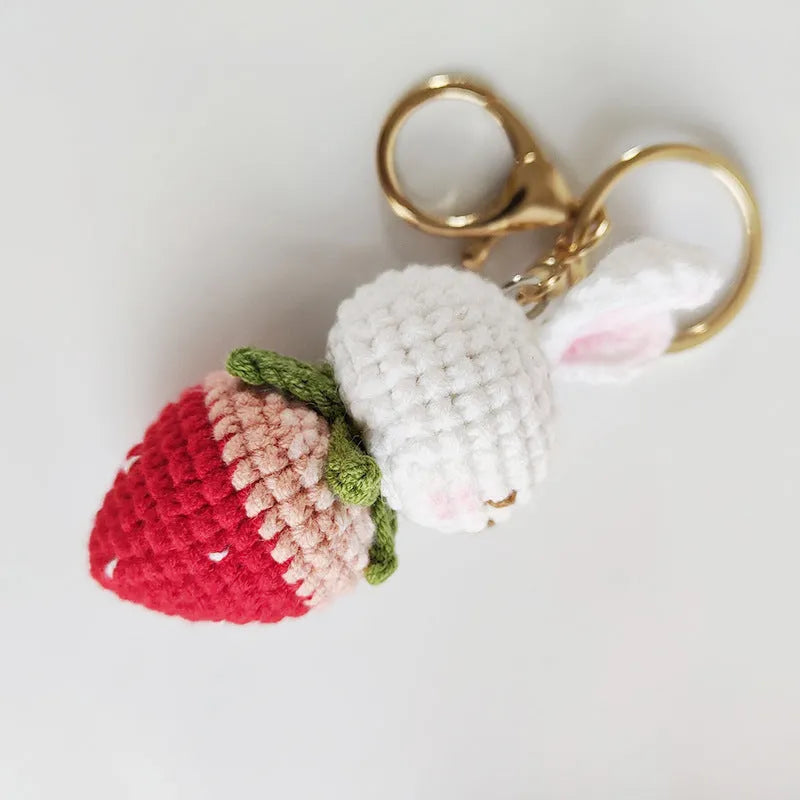 Hand-woven white wire pendant with rabbit strawberry pattern and attached key