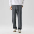 Men's casual loose straight-leg pants in solid colour with mid-high elastic waist and button fly front, available in plus sizes
