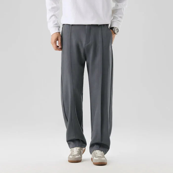 Men's casual loose straight-leg pants in solid colour with mid-high elastic waist and button fly front, available in plus sizes