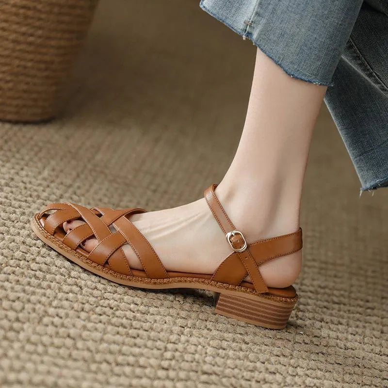 Women's flat closed toe sandals with word strap and buckle in beige colour