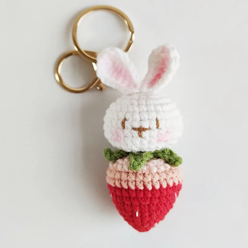 Hand-woven white wire pendant with rabbit strawberry pattern and attached key
