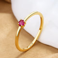 Copper ring with a fine circle geometric shape and single diamond detail, shown in a choice of colours.