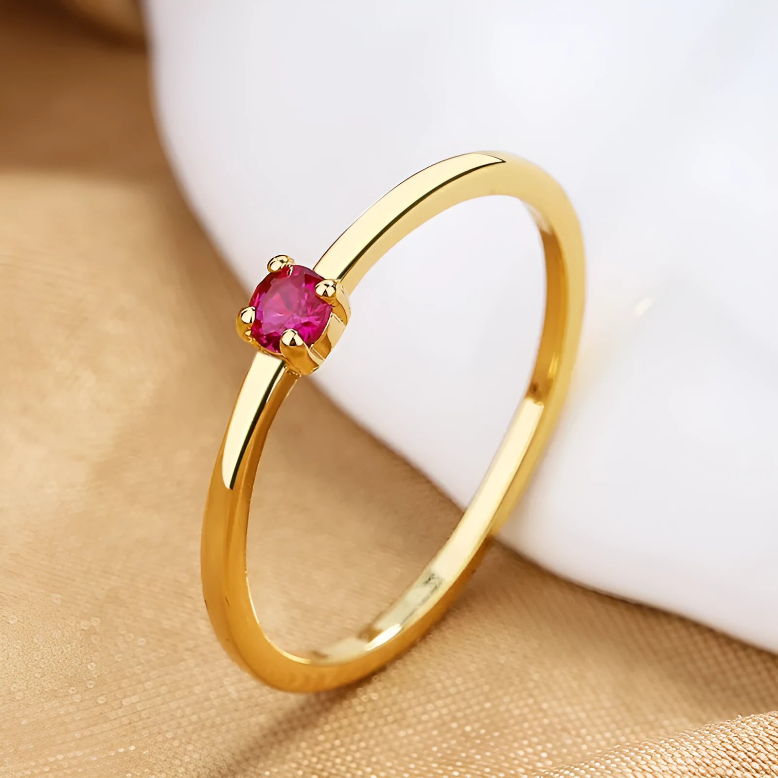 Copper ring with a fine circle geometric shape and single diamond detail, shown in a choice of colours.