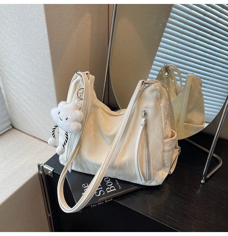 Women's soft PU leather fashion backpack in black colour with pendant accessory
