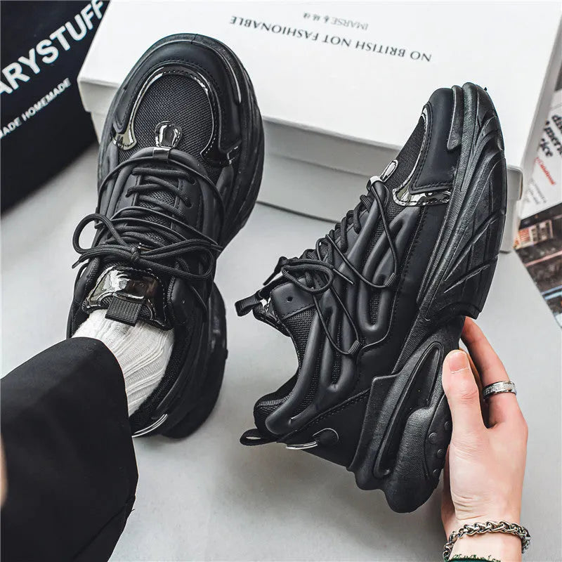 Men's beige and black low-top lace-up sneakers with mesh upper and rubber platform sole.